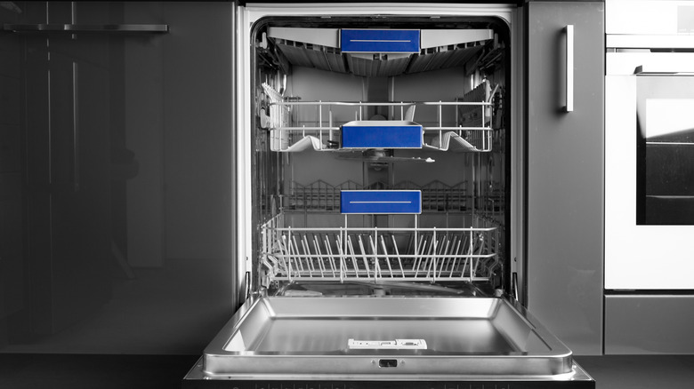 Built-in stainless steel dishwasher with its door open