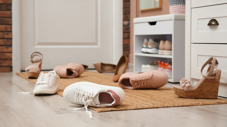 shoes cluttered on entryway floor