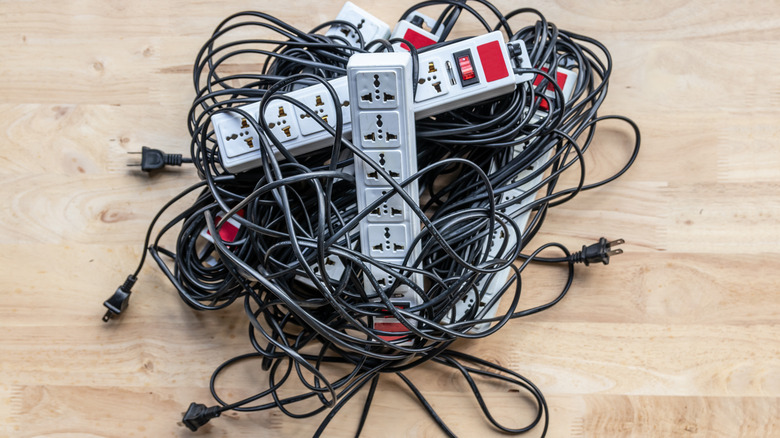 tangled black extension cords