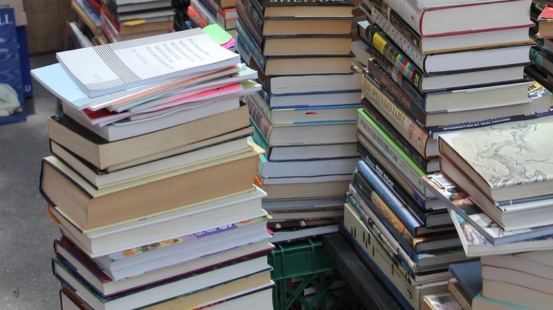 stacks of used hardcover and softcover books