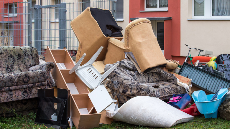 broken furniture thrown away outside