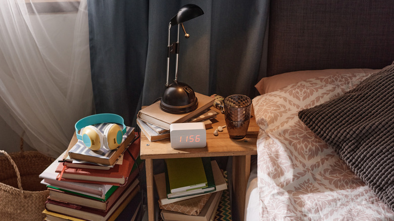 Messy chaotic overflowing nightstand 