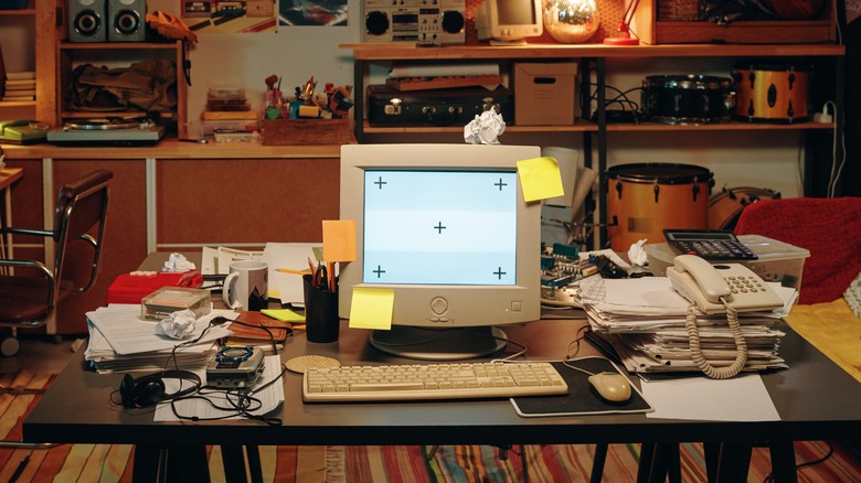 Documents and computer on table in garage