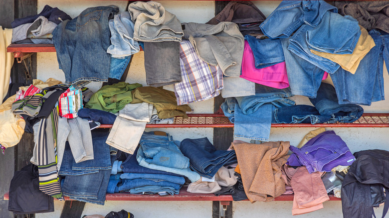 Old clothes on a messy shelf