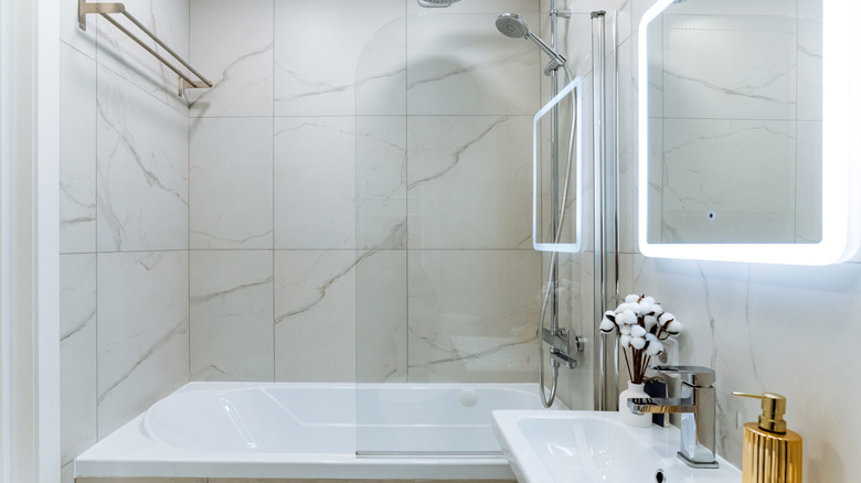 Modern-looking bathroom with marble shower tiles