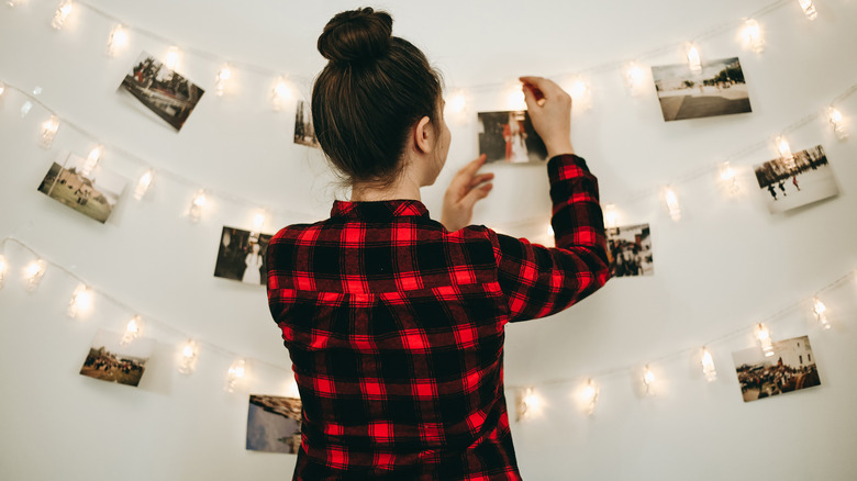 hanging photos on wall