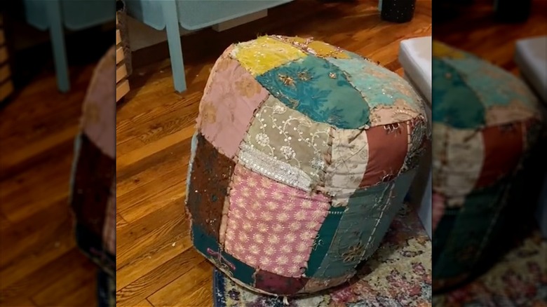 upcycled college tapestry into pouf