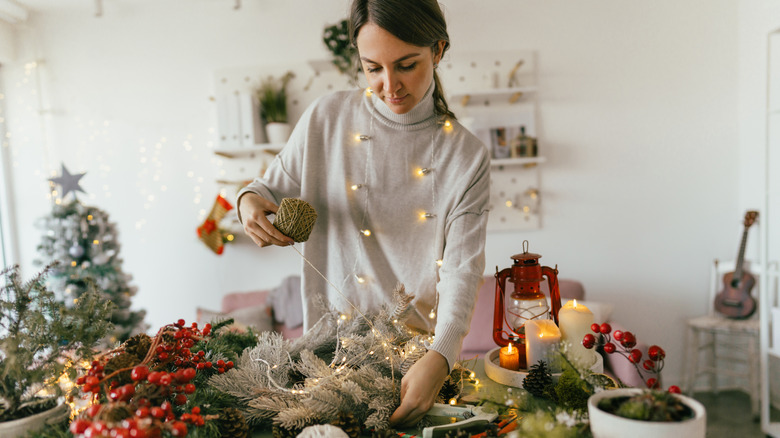 A woman makes Christmas crafts