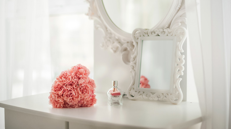 Pink flowers on dresser 