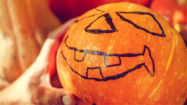 Painted Jack-o'-lantern face on pumpkin