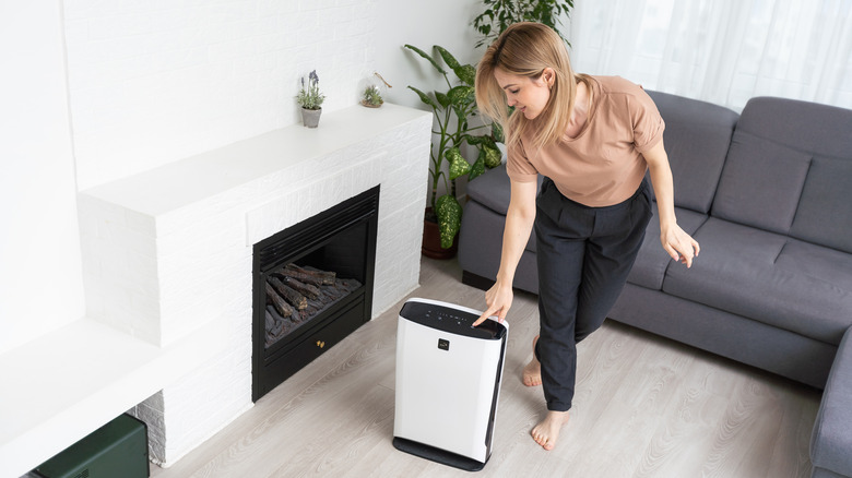 Person using dehumidifier