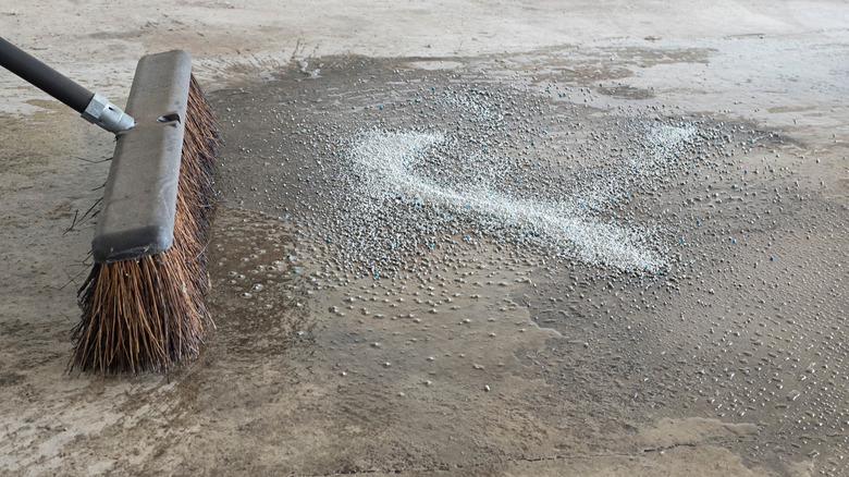 Cleaning a spill with cat litter