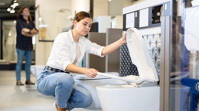 woman shopping for toilet seats