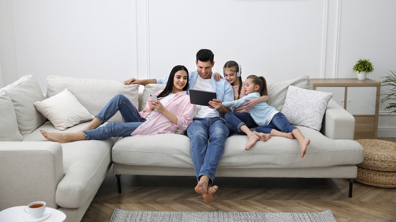 family on white couch