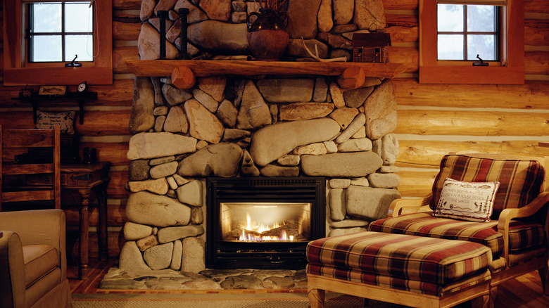 stone-paneled fireplace in cabin