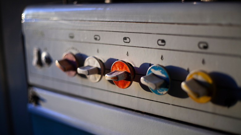 dials on an old gas stove