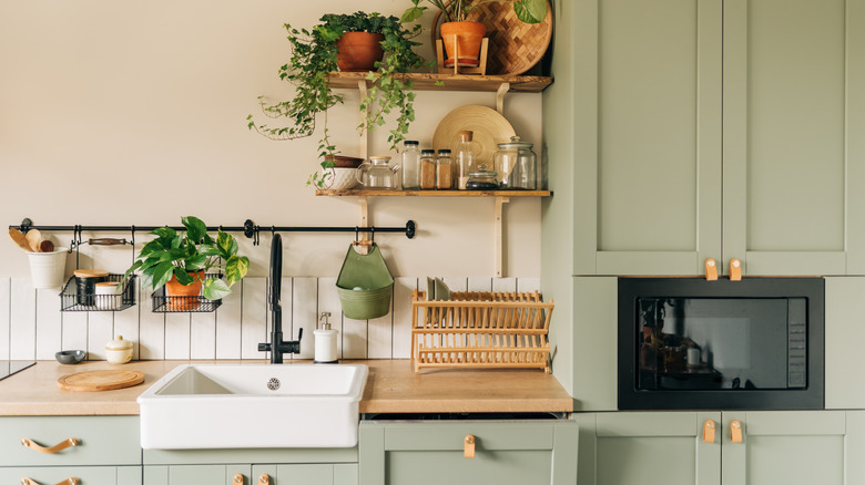 natural kitchen with green cabinets