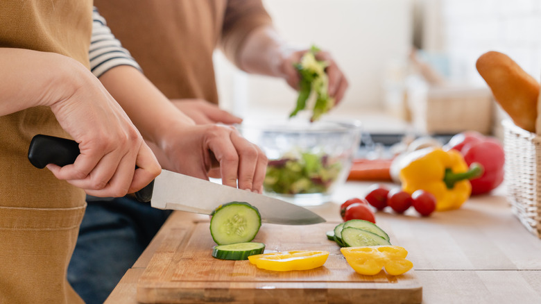 Chopping vegetables in kitchen