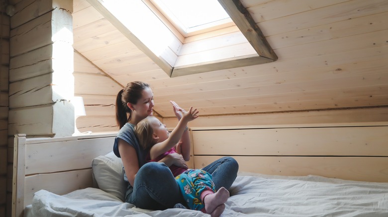 Woman and child under skylight