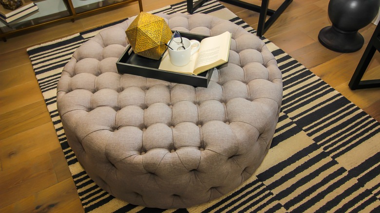 Upholstered ottoman in living room