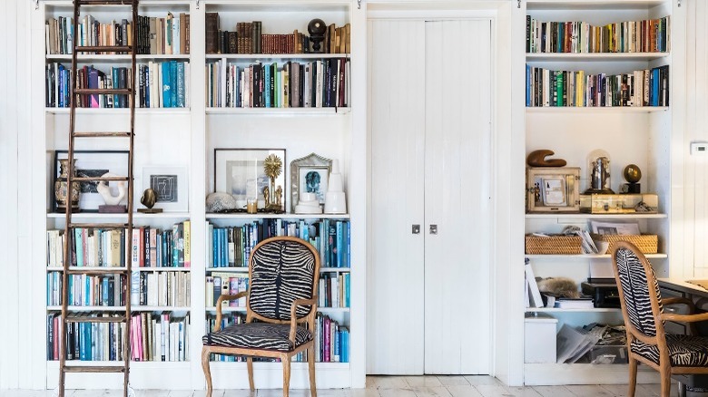 White wall of traditional bookshelves