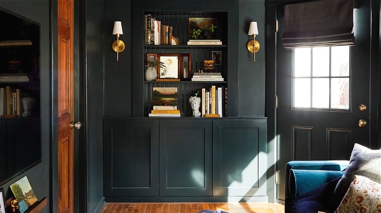 Dark green room with bookcase