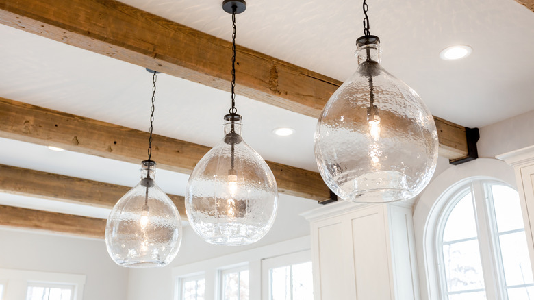 Wooden beams and light fixtures on ceiling