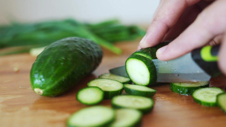 chopping cucumber