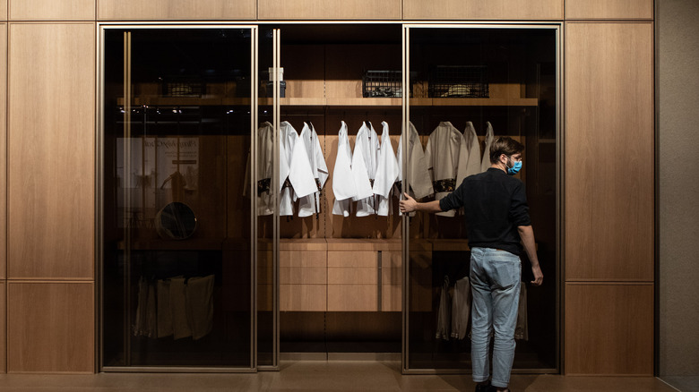 italian closet with clothes hanging