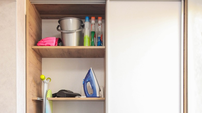 utility closet with bucket