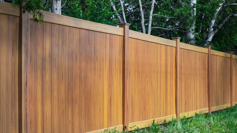 wooden fence with trim and caps