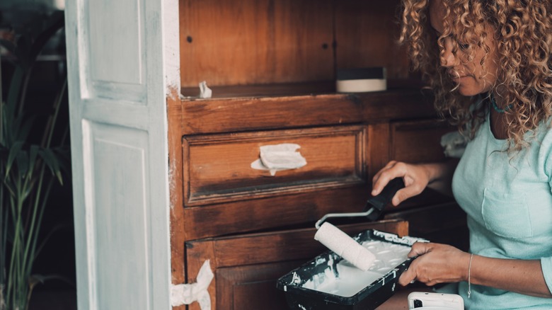 woman foam roller cabinet