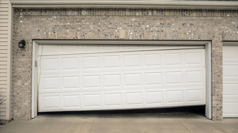 Sectional garage door popped out of alignment