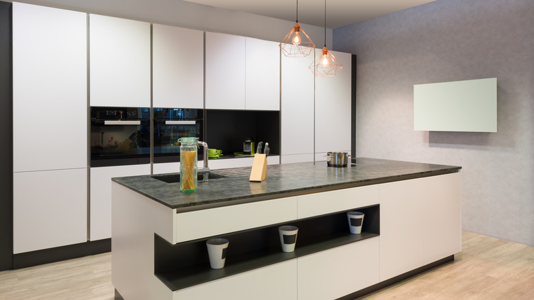 kitchen with white slab doors and an island