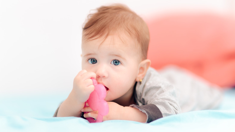 Baby with teething toy