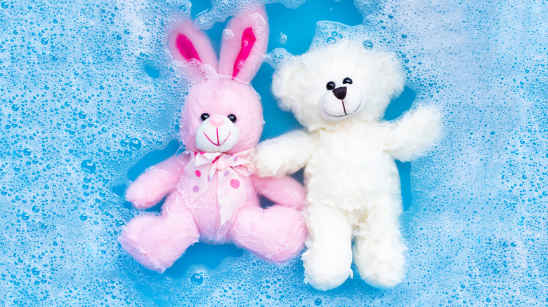 stuffed animals in soapy water