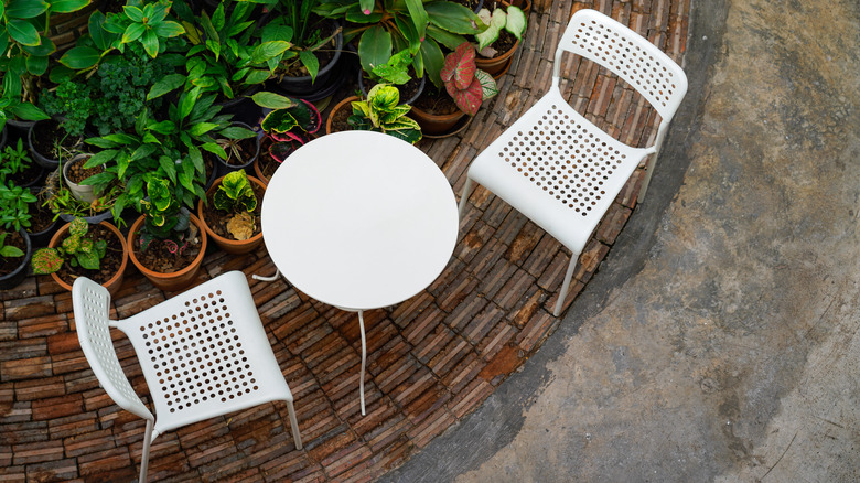 white plastic chairs and table