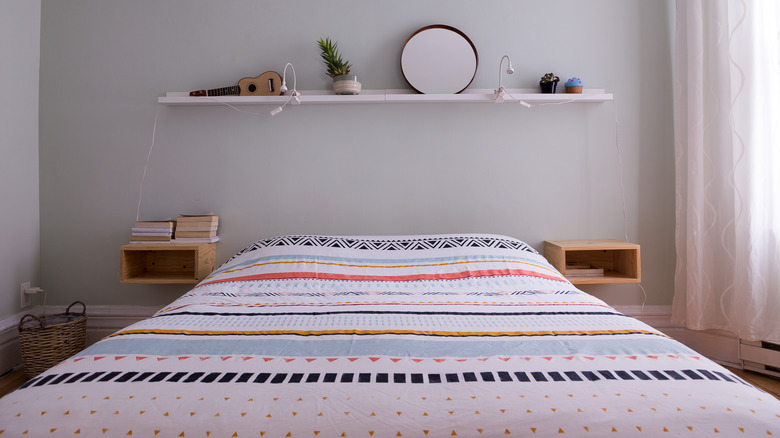 Floating shelves by bed for storage