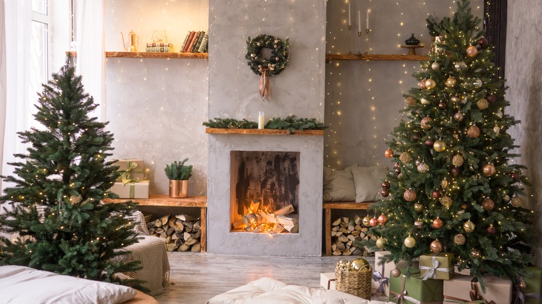 Decorated Christmas trees in living room with Scandinavian decor