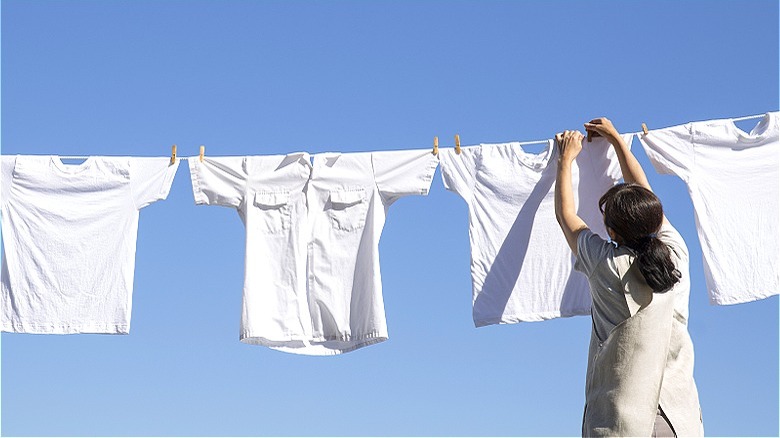 Person hanging whites to dry