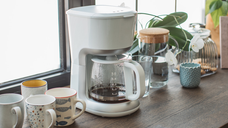 Coffee pot on brown wood counter