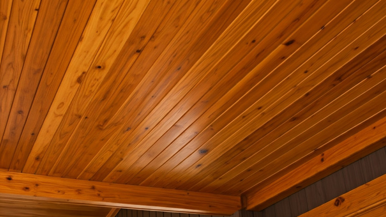 Warm lighting on a planked wood ceiling