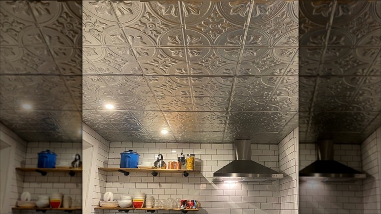 Silver metal ceiling tiles with ornate designs hanging in kitchen