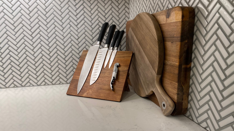 A chevron backsplash, knives, and cutting boards