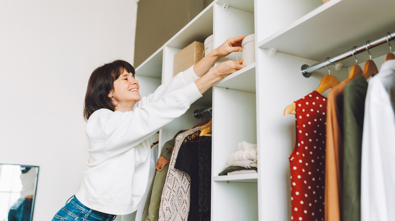 A woman organizing her closet