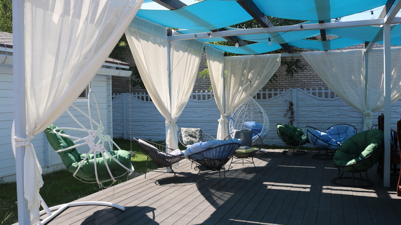 outdoor living room with curtains