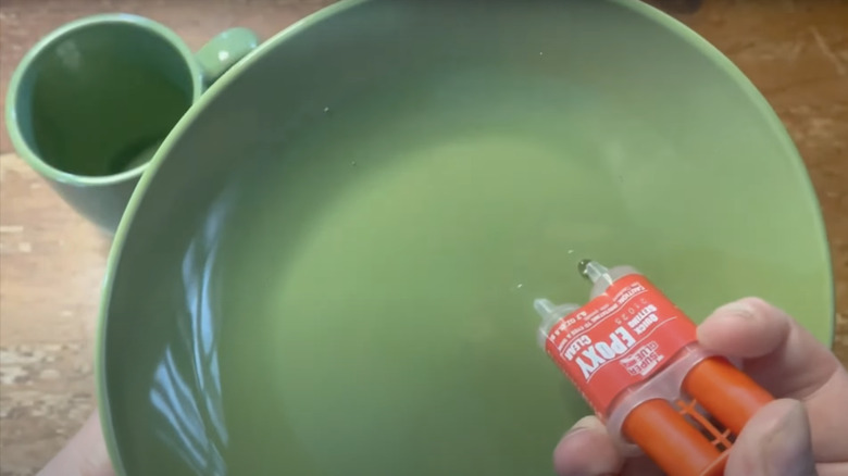 applying glue to dinner plate