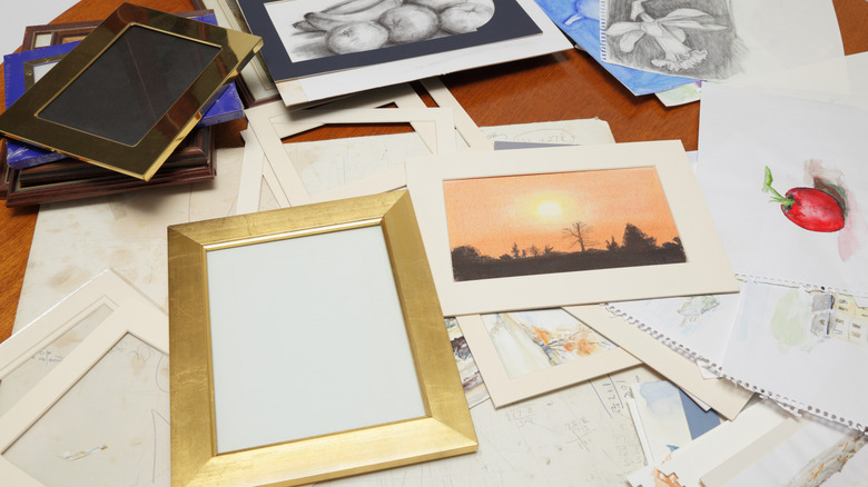 Stack of photos and mementos with frames