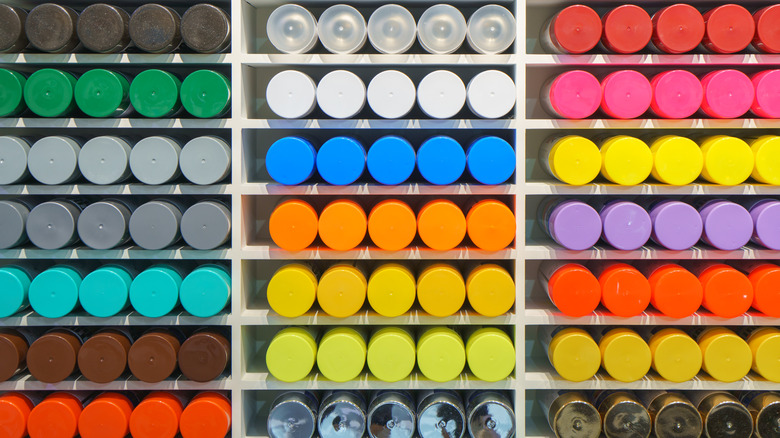 Colorful cans of spray paint in a store display