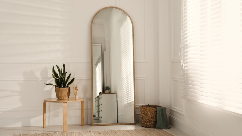 Arched golden framed mirror